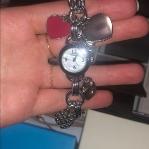 Silver charm bracelet with watch